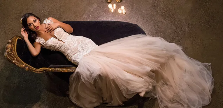 Bride laying on a chaise