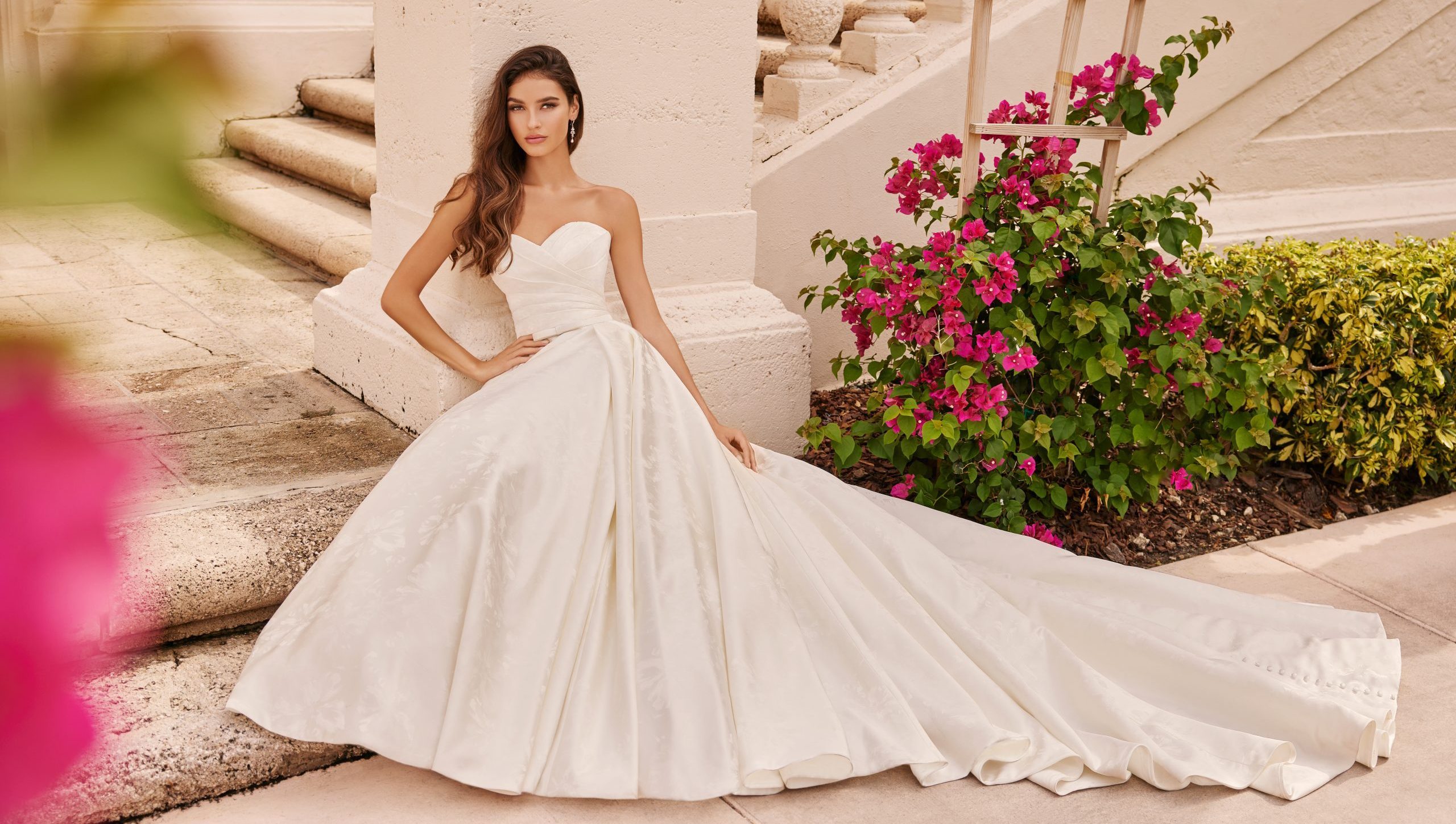 Bride sitting in a simple strapless ballgown
