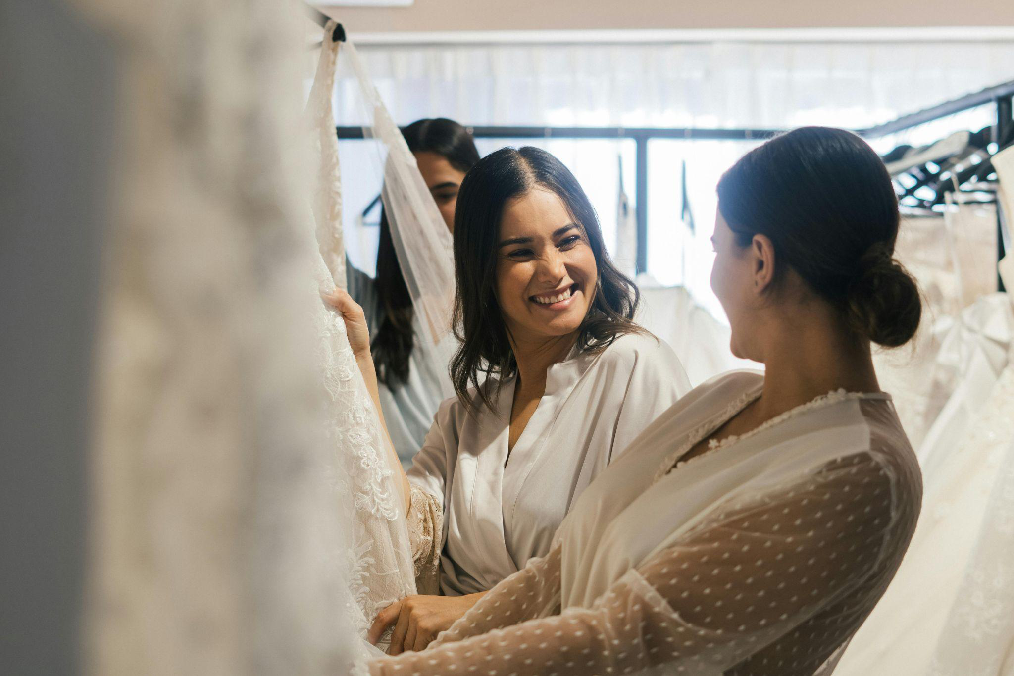 a bride shopping for a wedding dress with friends